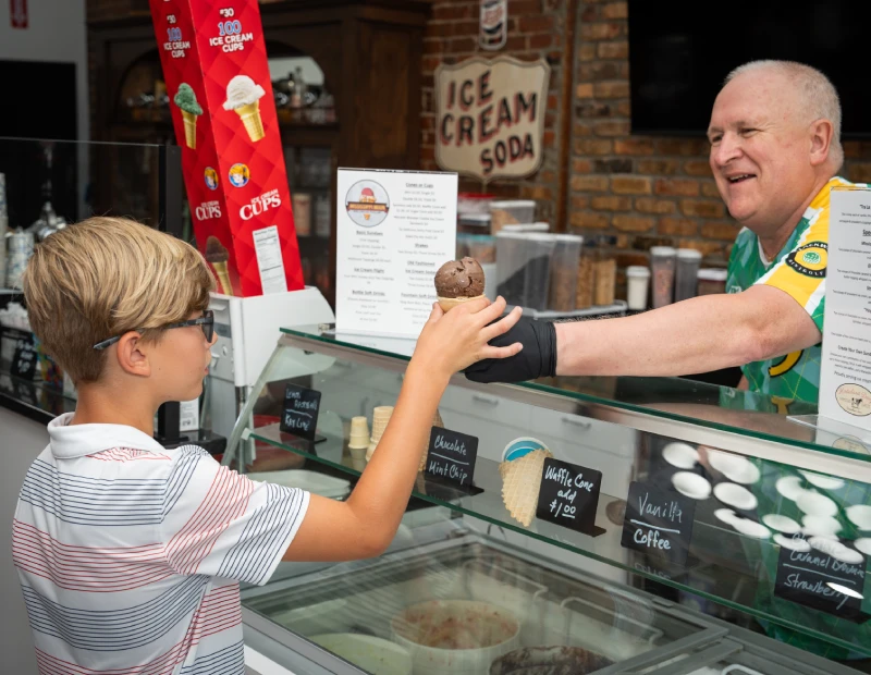 Handing over a chocolate cone